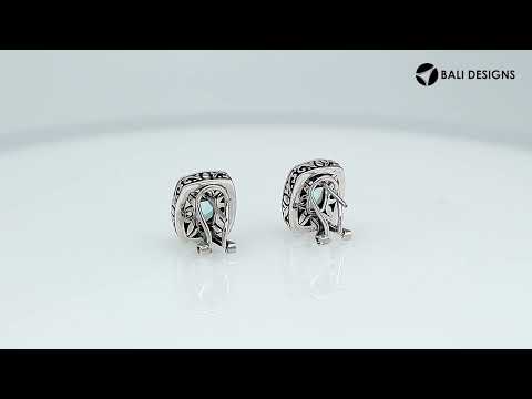 Wholesale sterling silver cushion-style earrings with Blue Topaz Quartz and handcrafted detailing.