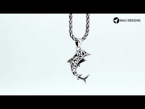 Sterling silver dolphin pendant with black shell inlay and traditional Balinese craftsmanship featuring a polished mirror finish.