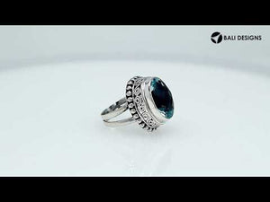 Wholesale sterling silver ring with faceted oval Blue Topaz Quartz, Balinese scroll and bead design – bulk handcrafted statement jewelry.