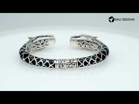 Wholesale sterling silver phoenix bangle featuring Black Shell insets, ornate Balinese scroll carving, and a sturdy hinge lock, crafted for premium artisan wholesale jewelry assortments.
