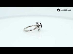 Sterling silver ring with a round Green Quartz and rope-style band design.