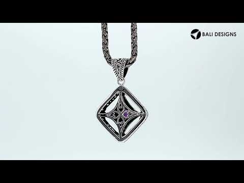 A handcrafted sterling silver pendant featuring a golden Citrine Quartz in an ornate Balinese filigree frame, showcasing fine silver artistry and elegance.