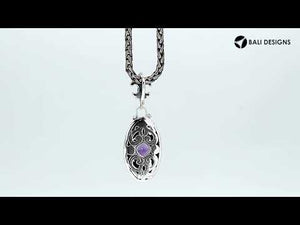 Sterling Silver Ornate Oval Pendant Featuring Blue Topaz Quartz With Fleur-De-Lis Decorative Bail.