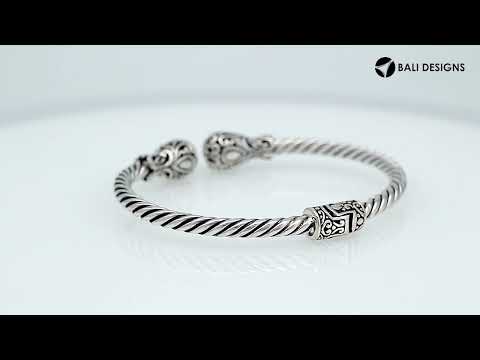 Sterling silver twisted bangle with ornate Balinese end design and oxidized finish
