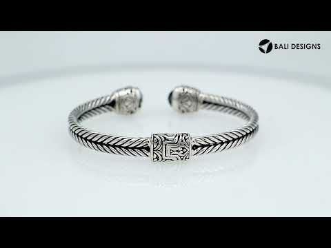 Sterling silver wholesale bangle with twisted rope design, Green Quartz end caps, and Balinese handcrafted details.