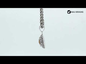 Sterling silver cushion pendant featuring a faceted Citrine Quartz centerpiece accented with intricate Balinese scroll carvings and a polished decorative frame.