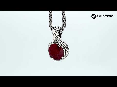 Sterling silver cushion pendant featuring faceted Ruby Quartz set in a Balinese engraved decorative frame.