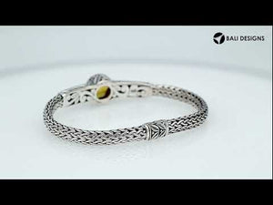 Wholesale sterling silver woven chain bracelet featuring a golden Citrine Quartz centerpiece, intricate Balinese leaf engravings, and a secure push clasp for premium gemstone assortments.