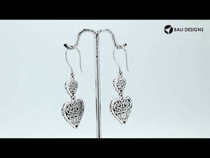 Wholesale sterling silver earrings featuring double red coral heart drops with ornate borders, crafted to deliver consistent artisan quality and strong catalog-ready appeal for bulk jewelry purchasers.