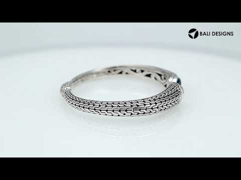 Wholesale sterling silver Bali engraved hinge cuff bracelet featuring bright blue topaz quartz accents with polished–oxidized artistry, crafted for premium wholesale jewelry inventory needs.