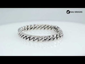 A finely crafted 925 sterling silver chain link bracelet featuring a Cubic Zirconia paved centerpiece with a polished finish and intricate interlocking chain design.