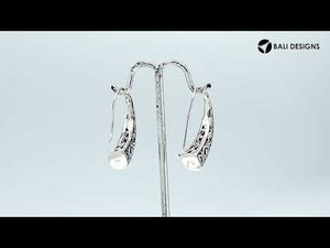 Wholesale Sterling Silver tapered curved earrings with oxidized scroll and geometric patterns.