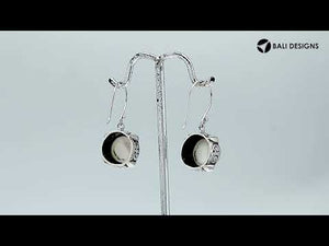 Wholesale sterling silver earrings with round white pearl and Bali-style handcrafted design.