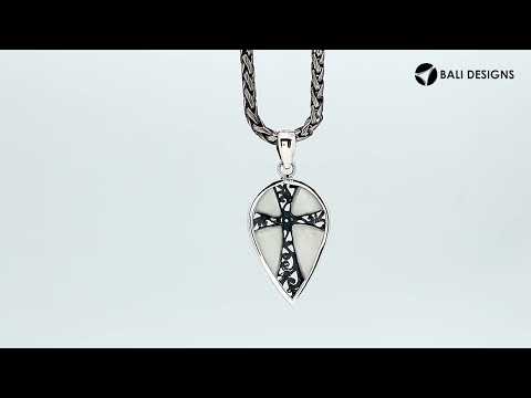 Wholesale sterling silver teardrop pendant with turquoise shell inlay and ornate cross design, handcrafted in Bali – artisan bulk jewelry for boutiques and resellers.