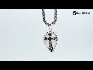 Wholesale sterling silver teardrop pendant with turquoise shell inlay and ornate cross design, handcrafted in Bali – artisan bulk jewelry for boutiques and resellers.