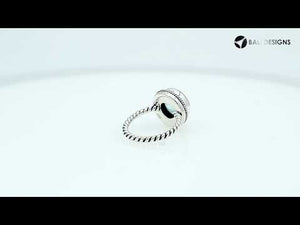 Sterling silver ring with a round Blue Topaz Quartz and rope-style band design.