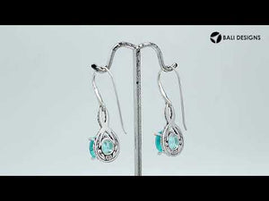 Wholesale Sterling Silver Blue Topaz Quartz Round Infinity Earrings With Detailed Balinese-Style Metalwork.