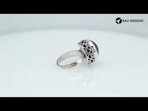 Wholesale sterling silver hematite ring with polished cabochon stone, rope bezel, and Balinese scroll detailing – handcrafted artisan jewelry from Bali.