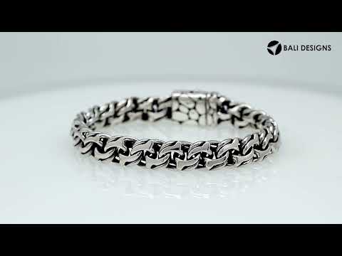 A wholesale sterling silver heavy woven bracelet featuring a textured push clasp, polished and oxidized detailing, and rugged craftsmanship designed for premium bulk jewelry collections.