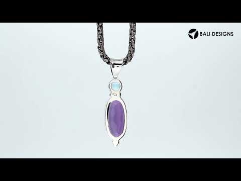 Sterling Silver Pendant With Amethyst Quartz And Blue Topaz Quartz In Oval Artisan Design.