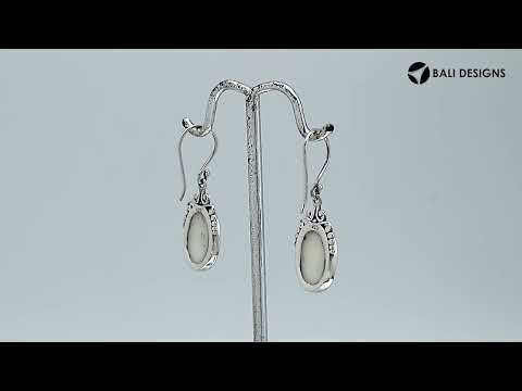 Sterling silver mother of pearl oval earrings with scroll and bead accent design for wholesale jewelry buyers