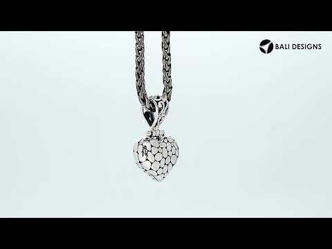 Wholesale sterling silver heart-shaped pendant with textured surface and ornate Balinese-style bail, handcrafted artisan jewelry from Bali.