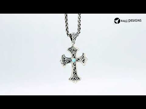Sterling silver cross pendant with faceted peridot gemstone and Balinese textured silver design, wholesale artisan jewelry.