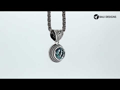 Wholesale sterling silver pendant with round Blue Topaz Quartz and ornate Balinese bail.