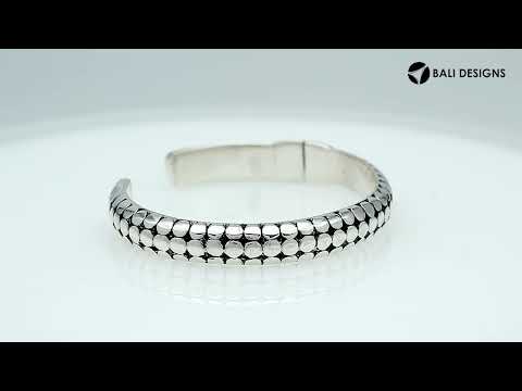 Sterling silver medium bangle featuring polished dot pattern detailing, oxidized accents, and a secure hinge lock crafted for reliable and stylish wholesale jewelry selections.