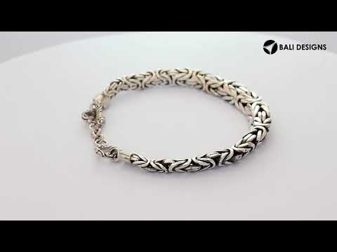 Wholesale sterling silver bracelet featuring a bold 7MM x 9MM braided chain with polished and oxidized details and a secure toggle lock for catalog-ready presentation.