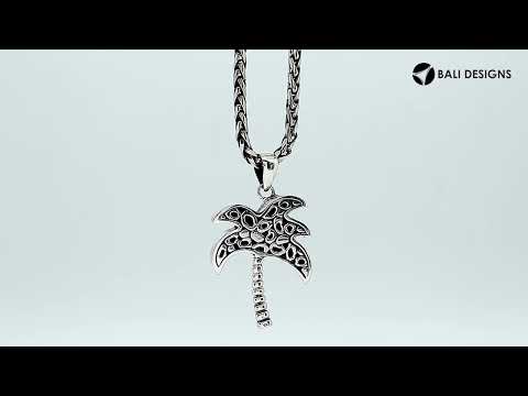 Sterling silver palm tree pendant with abalone shell inlay, handmade in Bali for wholesale jewelry buyers.