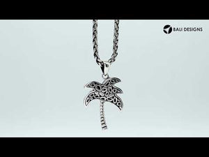 Sterling silver palm tree pendant with abalone shell inlay, handmade in Bali for wholesale jewelry buyers.