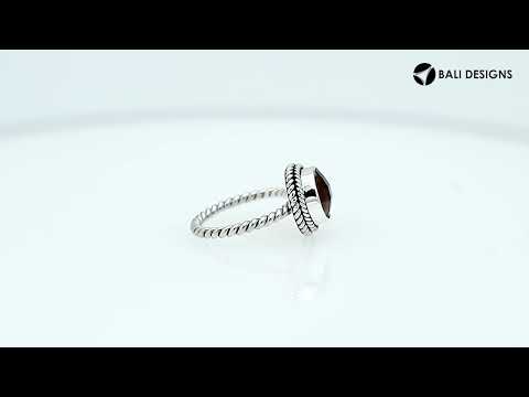 Sterling silver ring with a round Citrine Quartz and rope-style band design.