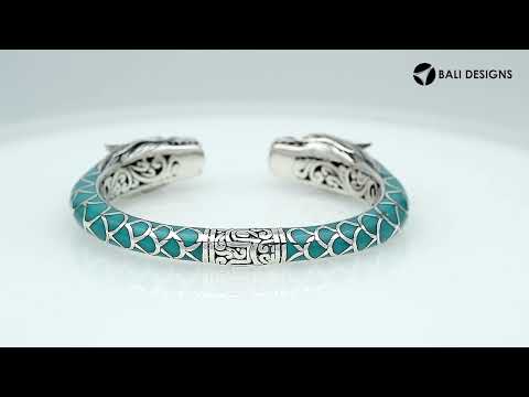Wholesale sterling silver phoenix bangle featuring Turquoise Shell accents, ornate Balinese scroll engravings, and a secure hinge lock crafted for premium artisan wholesale jewelry collections.
