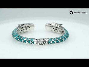Wholesale sterling silver phoenix bangle featuring Turquoise Shell accents, ornate Balinese scroll engravings, and a secure hinge lock crafted for premium artisan wholesale jewelry collections.