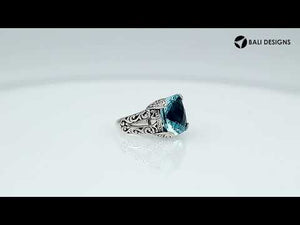Handcrafted 925 sterling silver ring with cushion-cut Blue Topaz Quartz, ornate Bali design.
