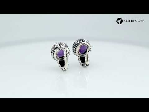 Wholesale sterling silver omega-clip earrings featuring faceted amethyst quartz set in ornate Balinese-style silverwork, created to deliver consistent artisan quality and strong catalog-ready visual appeal for bulk jewelry buyers.