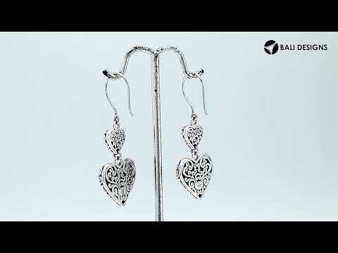 Wholesale sterling silver earrings featuring double turquoise shell hearts with ornate decorative borders, crafted to deliver consistent artisan quality and strong catalog-ready appeal for bulk jewelry buyers.