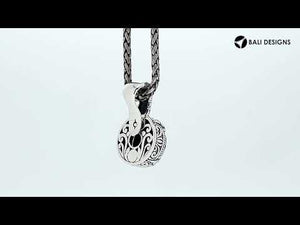 Sterling silver cushion pendant featuring faceted Amethyst Quartz set in a carved Balinese frame with polished high-gloss shine.