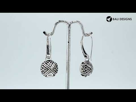 Wholesale sterling silver earrings featuring luminous Mabe pearls set in ornate Balinese-style silver detailing, crafted to deliver consistent artisan quality and an elegant catalog-ready presentation for wholesale jewelry buyers.