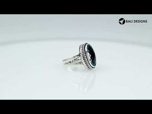 Wholesale sterling silver ring with faceted oval Blue Topaz Quartz, Balinese beaded border design – bulk handcrafted statement jewelry.