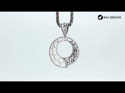 Sterling silver round pendant with pebble-textured design and open circle center, handcrafted Bali jewelry available for wholesale purchase.