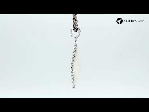 Wholesale sterling silver square pendant with carved bone centerpiece.