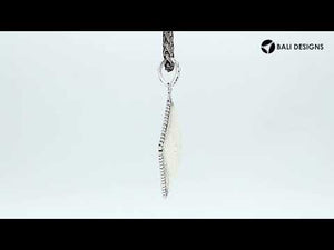 Wholesale sterling silver square pendant with carved bone centerpiece.