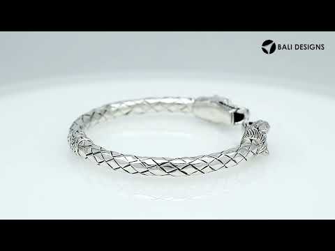 Wholesale sterling silver dragon head cuff bangle featuring detailed carvings, textured patterning, and a secure hinge-lock mechanism designed for reliable and consistent bulk inventory.