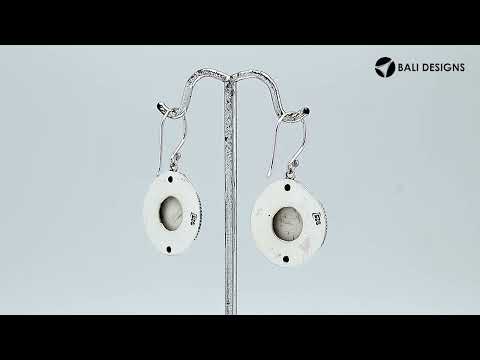 Wholesale sterling silver earrings with carved bone face and Peridot Quartz accents.