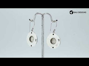 Wholesale sterling silver earrings with carved bone face and Peridot Quartz accents.