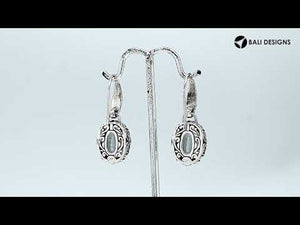 Wholesale sterling silver Black Onyx oval earwire earrings featuring floral hand-carved silver detailing, polished oxidized finish, secure earwire hooks, and bold black stone design created for premium wholesale jewelry collections.