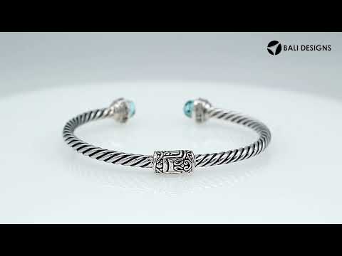 Sterling silver wholesale bangle with twisted rope design, Black Onyx and Cubic Zirconia accents, handcrafted Balinese motifs.