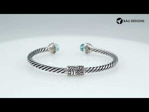 Sterling silver wholesale bangle with twisted rope design, Black Onyx and Cubic Zirconia accents, handcrafted Balinese motifs.